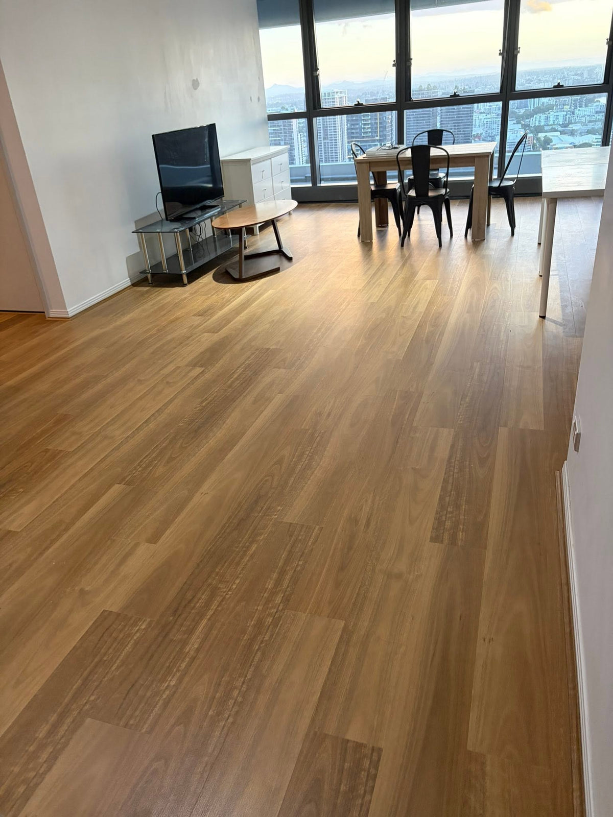 Hybrid flooring installed in an apartment living area